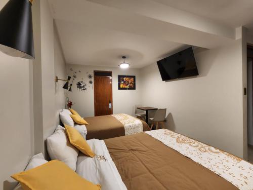 Ένα ή περισσότερα κρεβάτια σε δωμάτιο στο HOSTAL POSADA REAL