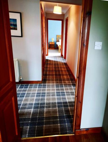 a hallway with a view of a room at Brackenbrae Holiday Cottage in Acharacle