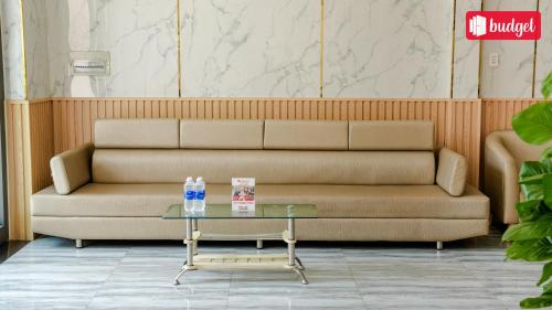 a couch sitting in a room with a table at Bich Thu Hotel in Ho Chi Minh City