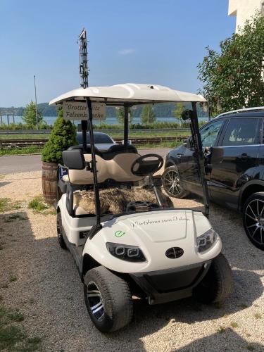 a golf cart parked in a parking lot at Gästehaus zum Felsen in Überlingen