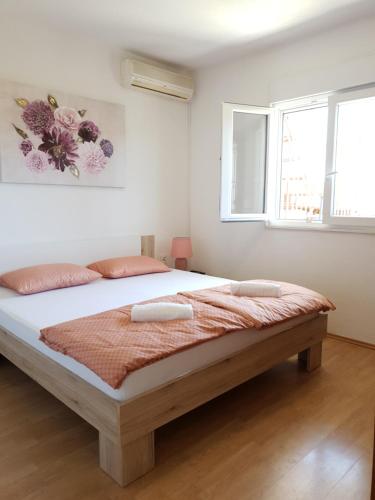 מיטה או מיטות בחדר ב-Apartment Viniška