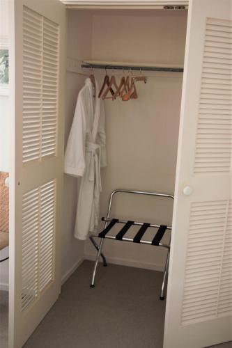 a walk in closet with a towel rack and a shelf at Magnolia House in Blenheim