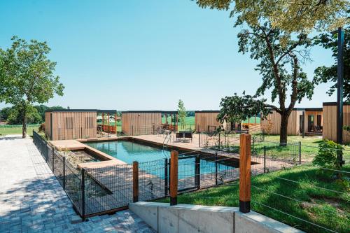a swimming pool with a fence around it at Wine paradise Glavinič in Miklavž pri Ormožu