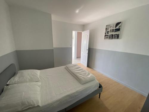 a bedroom with a bed and a hallway at Boost Your Immo La Rouvière Marseille 9E6 in La Panouse