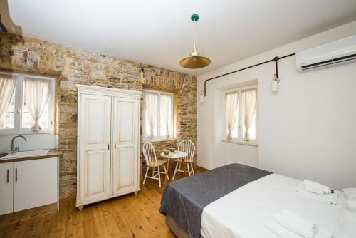 A bed or beds in a room at Calista Liston Corfu 2