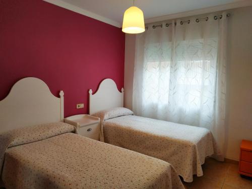 Postel nebo postele na pokoji v ubytování Vista Mar y Castillo Orangecosta