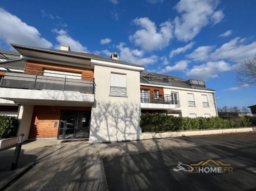 a white building with a street in front of it at 123home- Garden & Spa in Serris