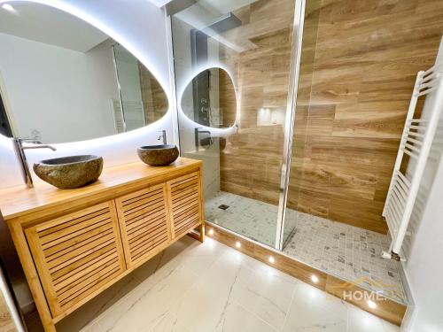 a bathroom with a sink and a shower at 123home- Garden & Spa in Serris