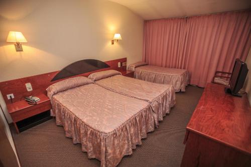 Postel nebo postele na pokoji v ubytování Hotel Roc Del Castell
