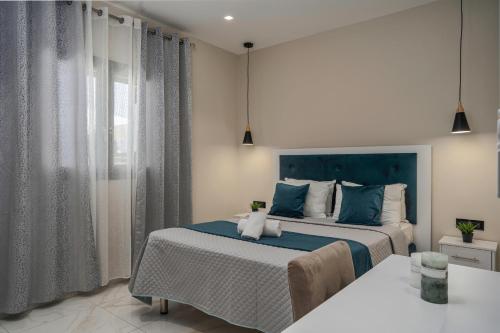 Ένα ή περισσότερα κρεβάτια σε δωμάτιο στο Blue Wind Villa II