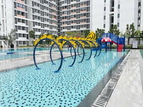 a pool with a water park with a playground at Horizon Suite Homestay, KLIA by S&T Homez in Sepang