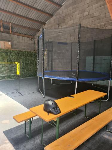 a gym with two trampolines with a helmet sitting on two tables at Jutta Deluxe Farmhouse in Zwettl Stadt