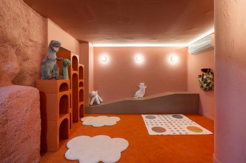 a childs room with a play room with a toy house at Petit Palace Puerta del Sol in Madrid