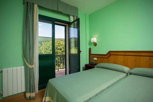 מיטה או מיטות בחדר ב-HOTEL PALACIO DE FIAME