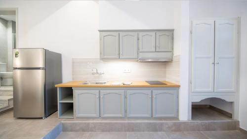 Kuchyň nebo kuchyňský kout v ubytování Horto View Suites