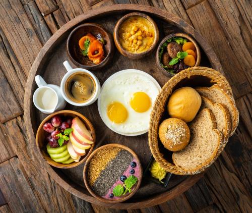 a plate of food with eggs bread and other foods at ABC Entertainment Resort in Angeles