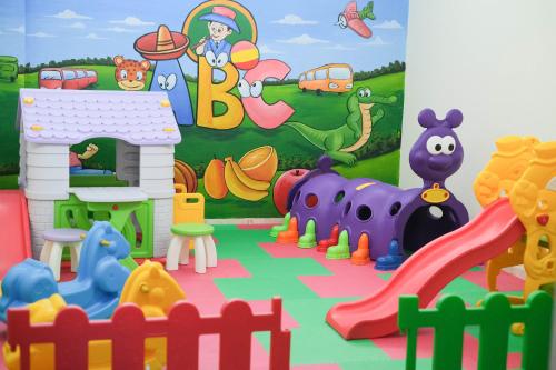 a play room with a play set and toys at Emersia Hotel and Resort in Bandar Lampung