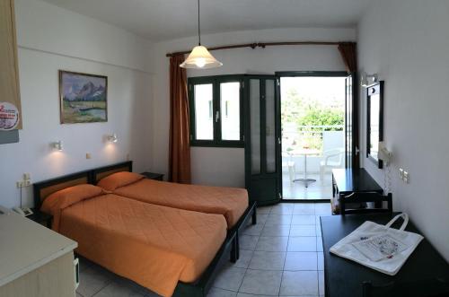 En eller flere senge i et værelse på Nikolas Villas Appartments