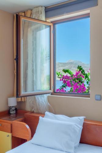 Un ou plusieurs lits dans un hébergement de l'établissement Stefanakis Villas - Car Included