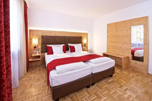 Ένα ή περισσότερα κρεβάτια σε δωμάτιο στο Park Hotel Laim Serviced Apartments