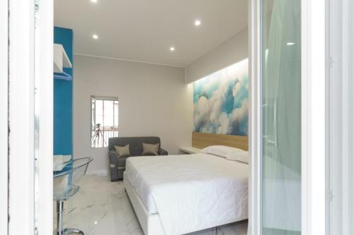 Postel nebo postele na pokoji v ubytování Nuvole Apartment near the beach