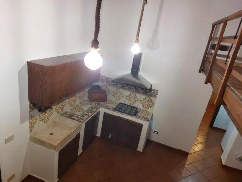 an overhead view of a kitchen with two lights at La Casa di Cofano in Custonaci