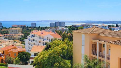 a view of a city with buildings and the ocean at Superb Apartment in Alvor in Alvor