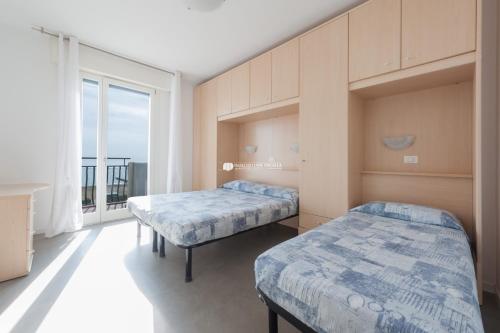 מיטה או מיטות בחדר ב-Residence El Palmar Immobiliare Pacella