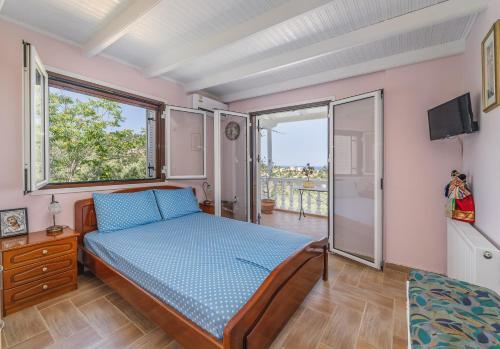 Ένα ή περισσότερα κρεβάτια σε δωμάτιο στο VILLA PANOREA