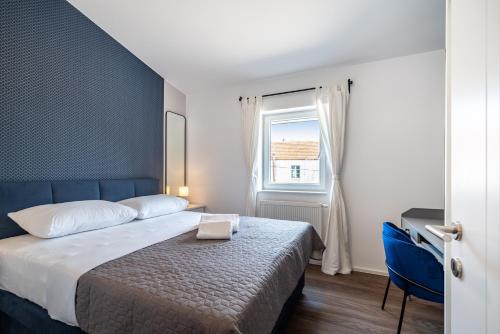 Postel nebo postele na pokoji v ubytování Dvije Masline - renovated 2022