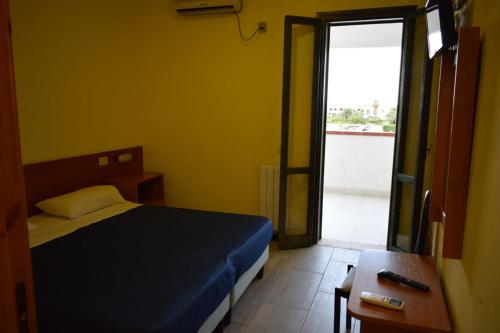 Una cama o camas en una habitación de Hotel Oleandro