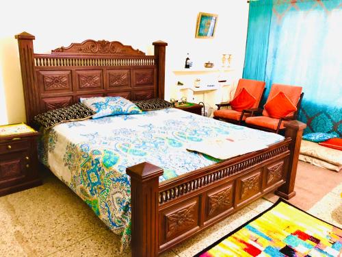 Cama ou camas em um quarto em Al-Noor Cottage