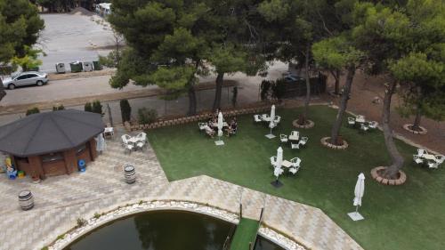 an aerial view of a park with tables and chairs at Hotel El Cisne in Zaragoza