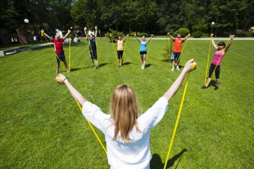 a group of people standing in a circle with their arms up at Terme Zrece - Hotel Vital in Zreče