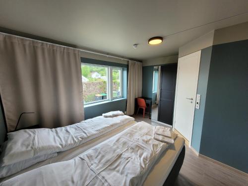 Ένα ή περισσότερα κρεβάτια σε δωμάτιο στο Telemark Apartments Langgt 48