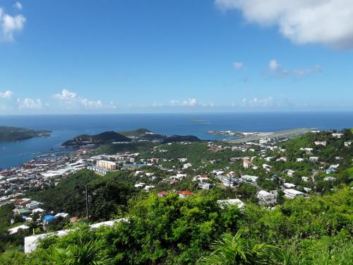 a view of a city and the ocean at One Seven Solberg in St Thomas