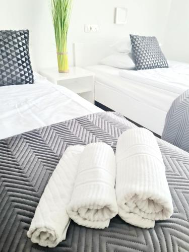 Voodi või voodid majutusasutuse AZUR ROOMS LJUBLJANA toas