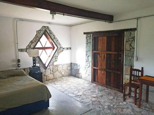 Säng eller sängar i ett rum på Casa Montagnola: naturaleza y tranquilidad