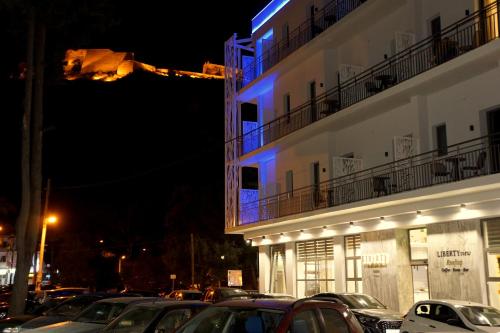 a building with a blue light on it at night at Liberty of Nafplio in Nafplio