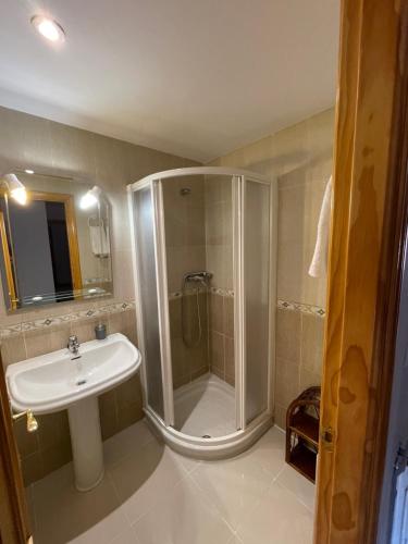 a bathroom with a shower and a sink at Atico HouseGom in Cazorla