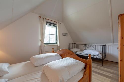 Postel nebo postele na pokoji v ubytování Buitenplaats 138 Callantsoog