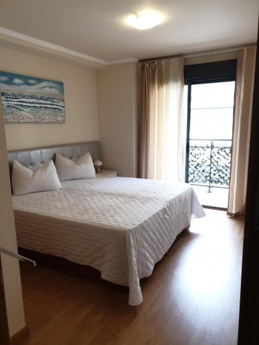 Postel nebo postele na pokoji v ubytování Apartamento Residencial Carmen