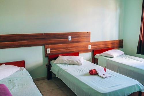 Postel nebo postele na pokoji v ubytování Hotel Pato Branco