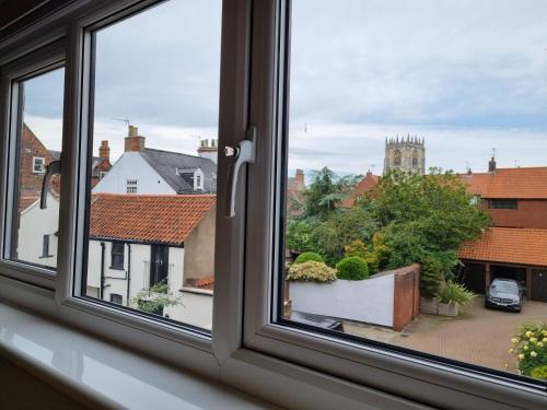 a window with a view of a city at Holiday Apartment Beverley in Beverley