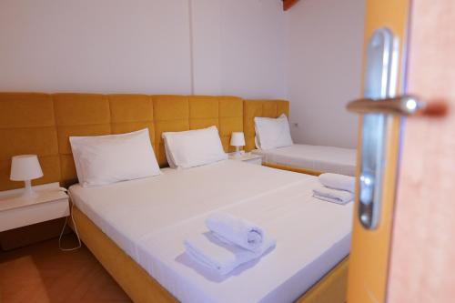 Postel nebo postele na pokoji v ubytování Vila Olsi
