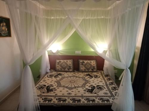 Ένα ή περισσότερα κρεβάτια σε δωμάτιο στο Villa Bentota River View