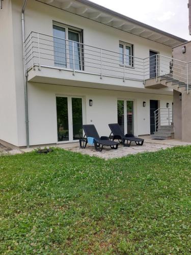 a house with two benches in front of it at Skylab in Gozzano