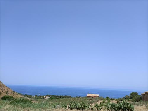 a view of the ocean from a hill at Casolare La Torre in Scopello