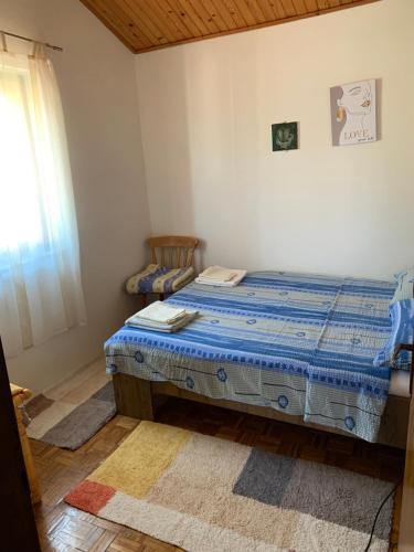Un pat sau paturi într-o cameră la Apartment Aida