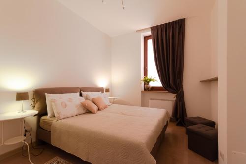 Ein Bett oder Betten in einem Zimmer der Unterkunft Dimora al Borgo